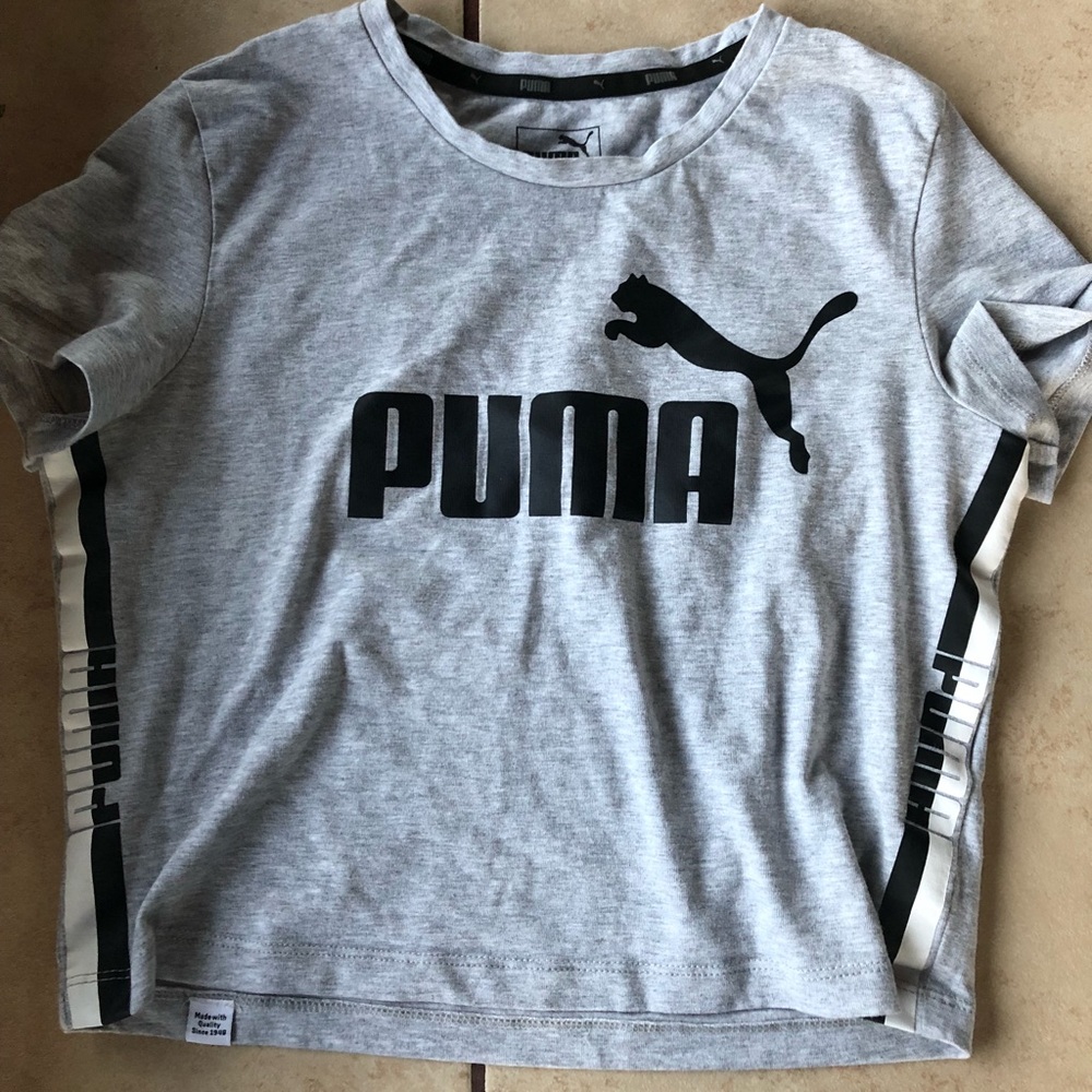 Gray cropped puma shirt with logo along the sides.